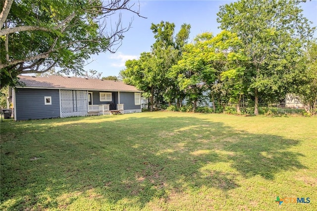 view of yard with covered porch