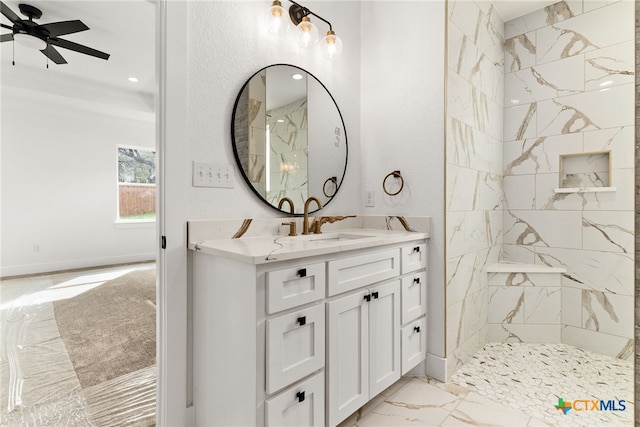 6 E Pima Ln, Belton, TX 76513 - full bath with marble look tiles, vanity, a ceiling fan, a marble finish shower, and baseboards