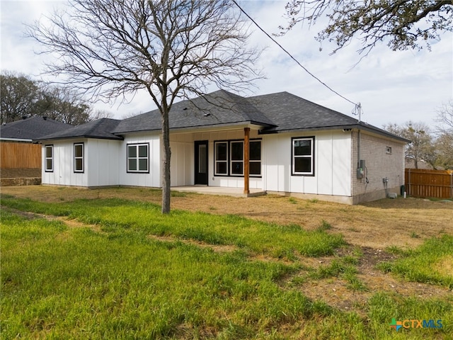 6 E Pima Ln, Belton, TX 76513 - back of house featuring board and batten siding, a patio area, brick siding, and a shingled roof