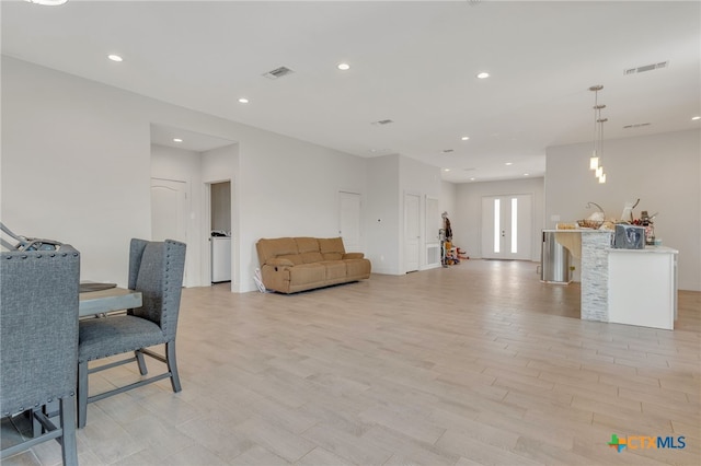 living room with light hardwood / wood-style floors