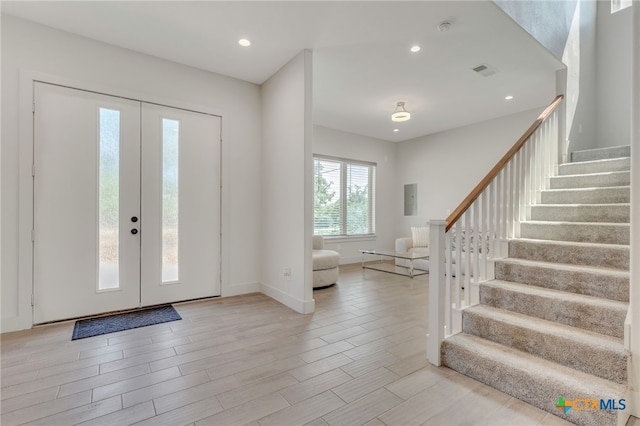 foyer entrance with light hardwood / wood-style flooring