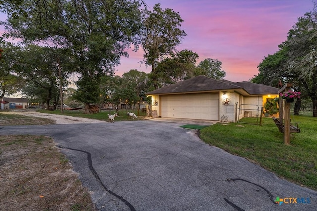 1843 Burr Oak Ln, Adkins, TX 78101 - view of front of house with asphalt driveway, a garage, and brick siding