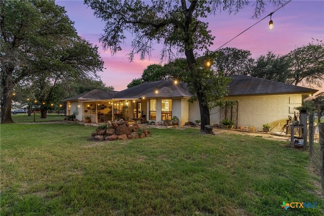 1843 Burr Oak Ln, Adkins, TX 78101 - back of property at dusk with a lawn