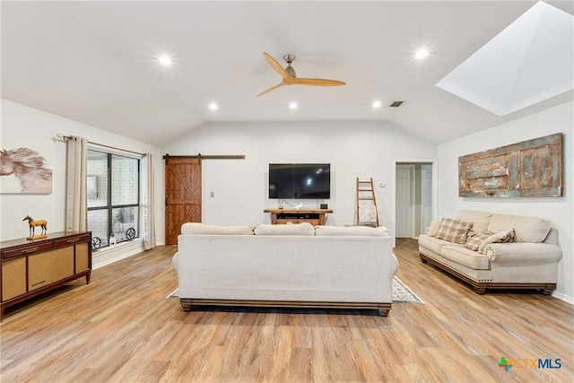 1843 Burr Oak Ln, Adkins, TX 78101 - living area with a barn door, lofted ceiling, light wood-style floors, ceiling fan, and recessed lighting