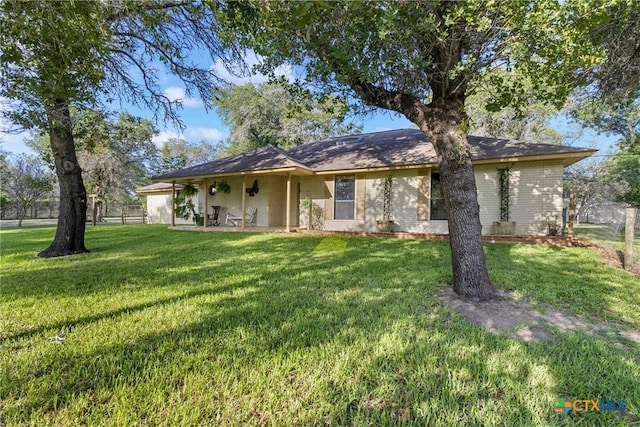 1843 Burr Oak Ln, Adkins, TX 78101 - rear view of property featuring a yard and brick siding