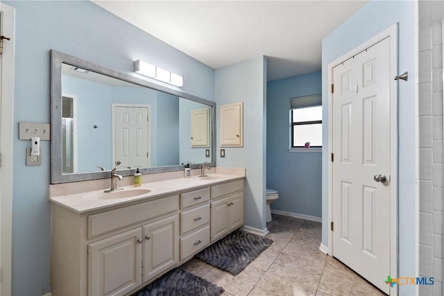 1843 Burr Oak Ln, Adkins, TX 78101 - bathroom featuring double vanity and tile patterned floors