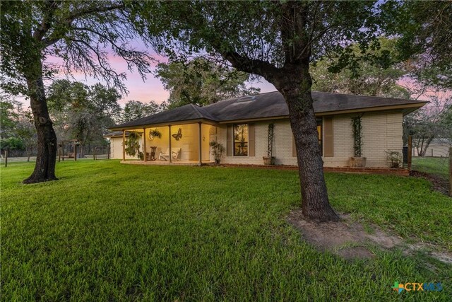 1843 Burr Oak Ln, Adkins, TX 78101 - view of front facade featuring a front lawn and brick siding
