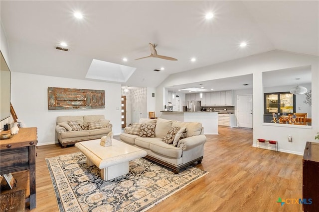 1843 Burr Oak Ln, Adkins, TX 78101 - living area featuring lofted ceiling, a skylight, light wood-style flooring, ceiling fan, and recessed lighting