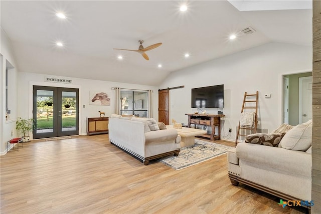 1843 Burr Oak Ln, Adkins, TX 78101 - living area featuring lofted ceiling, a barn door, recessed lighting, light wood finished floors, and a ceiling fan