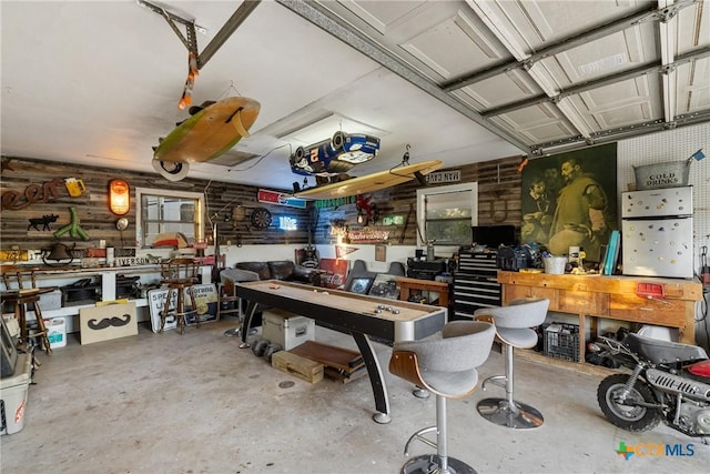 1843 Burr Oak Ln, Adkins, TX 78101 - garage featuring a workshop area