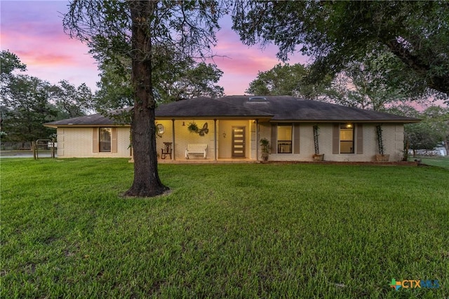 1843 Burr Oak Ln, Adkins, TX 78101 - rear view of house featuring a yard and brick siding