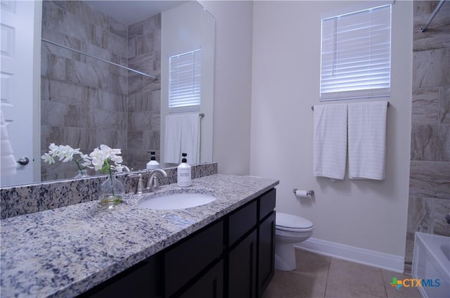 full bath with baseboards, toilet, a bathtub, tile patterned floors, and vanity