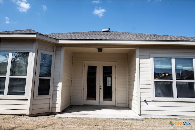 view of exterior entry featuring french doors