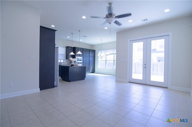 unfurnished living room featuring light tile patterned floors, recessed lighting, french doors, and a ceiling fan