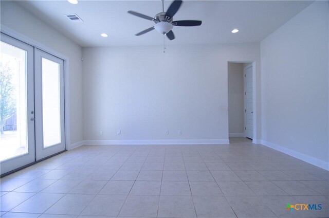 unfurnished room with recessed lighting, french doors, visible vents, and baseboards