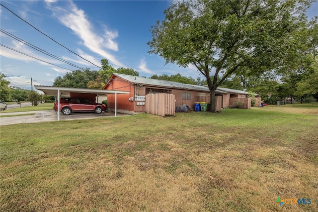 view of yard with a carport