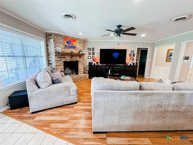 1802 Plantation Rd, Victoria, TX 77904 - living area with ornamental molding, ceiling fan, a brick fireplace, light wood-type flooring, and recessed lighting