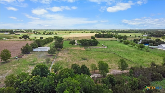 birds eye view of property with a rural view