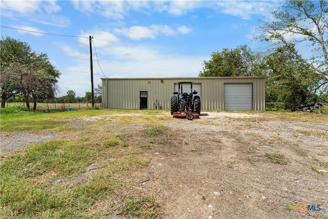 view of outdoor structure with a garage