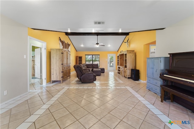 living room with light tile patterned flooring, ceiling fan, and vaulted ceiling with beams