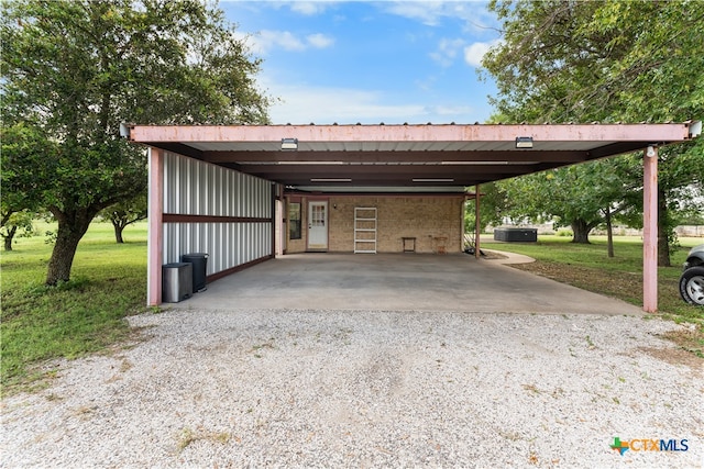 view of vehicle parking with a lawn