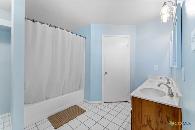 bathroom with vanity, shower / bath combo with shower curtain, and tile patterned floors