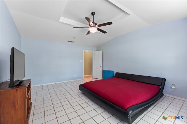 bedroom with ceiling fan, light tile patterned floors, and lofted ceiling