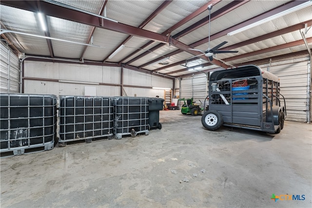 garage featuring ceiling fan and a carport