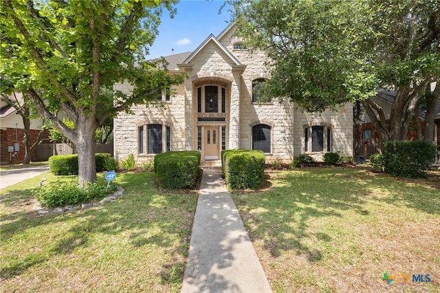 6804 Robert Dixon Dr, Austin, TX 78749 - french country home featuring stone siding and a front lawn