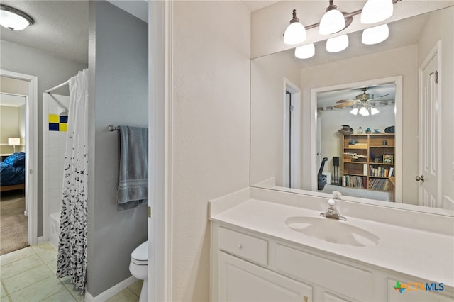 6804 Robert Dixon Dr, Austin, TX 78749 - ensuite bathroom featuring a ceiling fan, tile patterned floors, toilet, and vanity