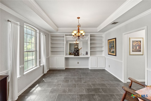 6804 Robert Dixon Dr, Austin, TX 78749 - unfurnished dining area with built in shelves, a chandelier, ornamental molding, dark tile patterned flooring, and baseboards