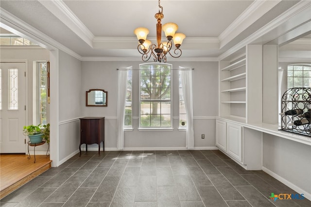6804 Robert Dixon Dr, Austin, TX 78749 - foyer with a chandelier, a tray ceiling, ornamental molding, and baseboards