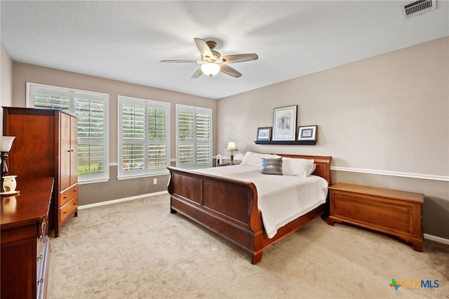 6804 Robert Dixon Dr, Austin, TX 78749 - bedroom featuring baseboards, light carpet, and ceiling fan