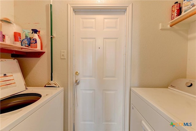 laundry area featuring washing machine and dryer