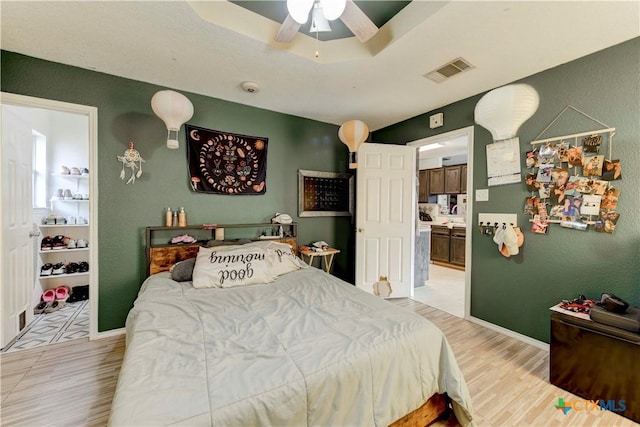 bedroom featuring ceiling fan and light hardwood / wood-style flooring