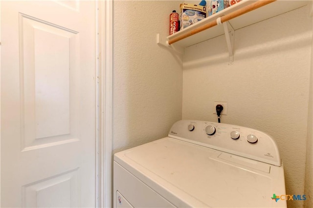 laundry room featuring washer / dryer