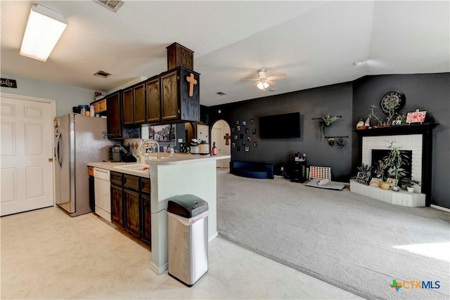 kitchen with kitchen peninsula, dark brown cabinets, ceiling fan, dishwasher, and lofted ceiling