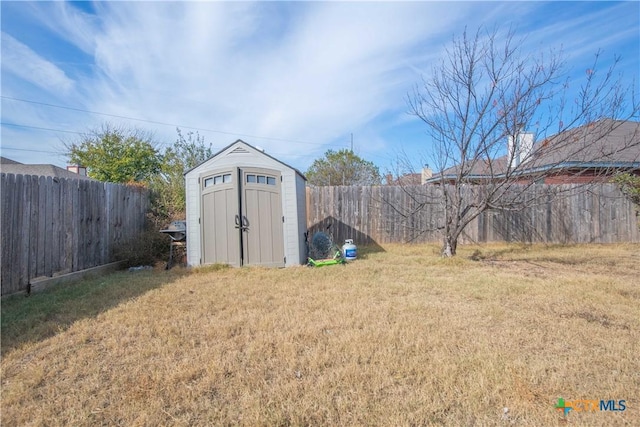 view of outbuilding with a yard