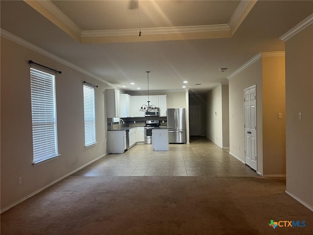 9210 Devonshire Ct, Killeen, TX 76542 - kitchen featuring appliances with stainless steel finishes, light colored carpet, baseboards, white cabinets, and crown molding
