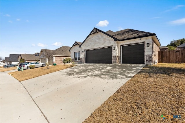 view of front of home featuring a garage and a front lawn