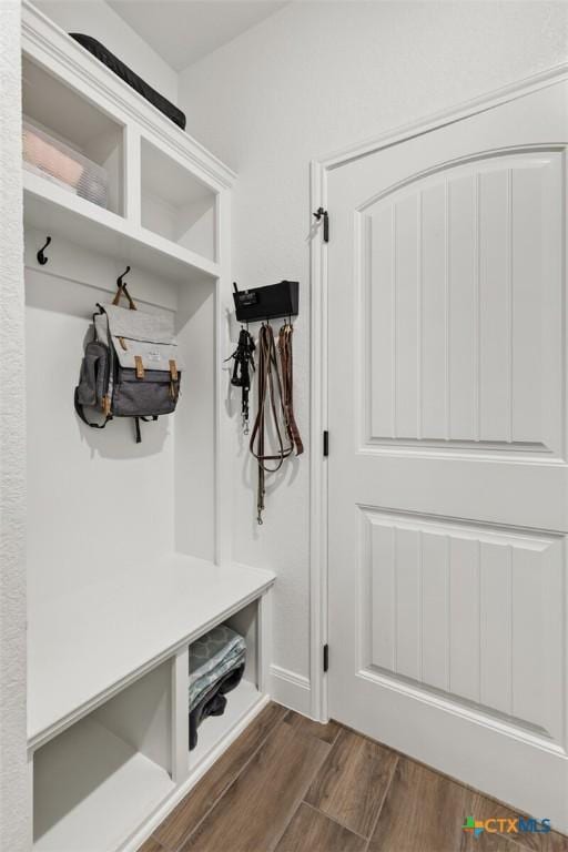 mudroom featuring dark wood-type flooring