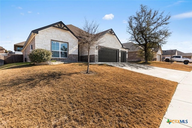 view of front facade with a garage and a front lawn