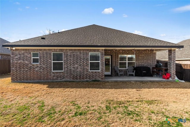 back of property with a patio