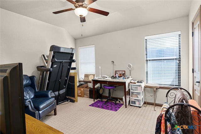 office space featuring baseboards, ceiling fan, carpet floors, and vaulted ceiling