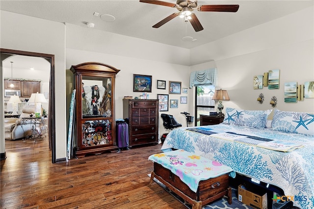 bedroom with ceiling fan and wood-type flooring