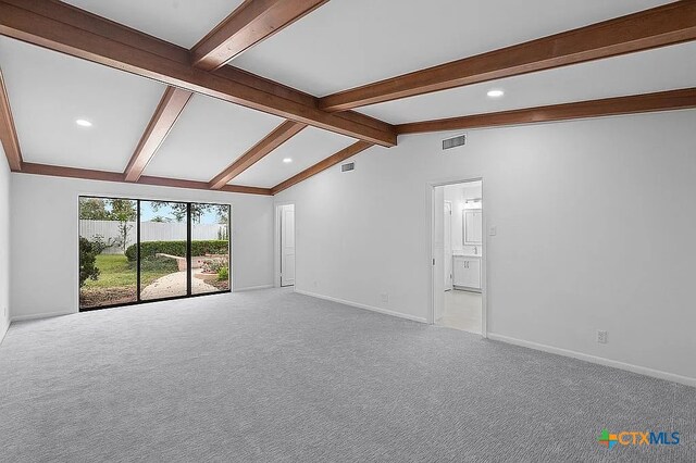 carpeted spare room featuring recessed lighting, vaulted ceiling with beams, baseboards, and visible vents