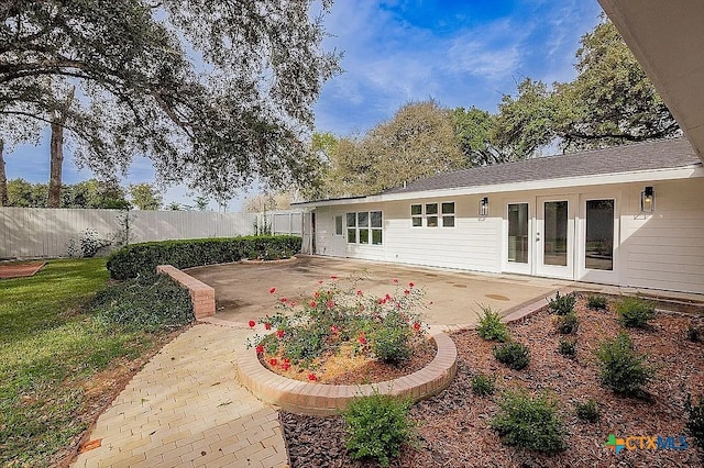 back of house featuring french doors, a patio, and fence