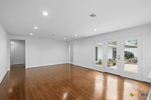 spare room featuring visible vents, recessed lighting, french doors, and wood finished floors