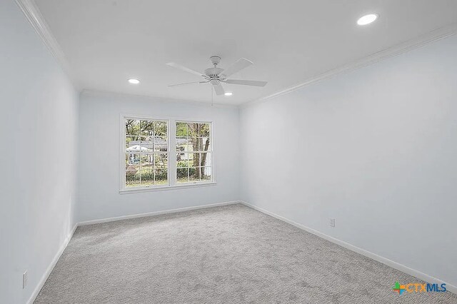 unfurnished room featuring crown molding, baseboards, carpet flooring, recessed lighting, and a ceiling fan