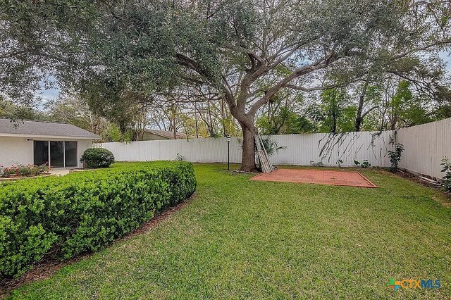 view of yard with a fenced backyard